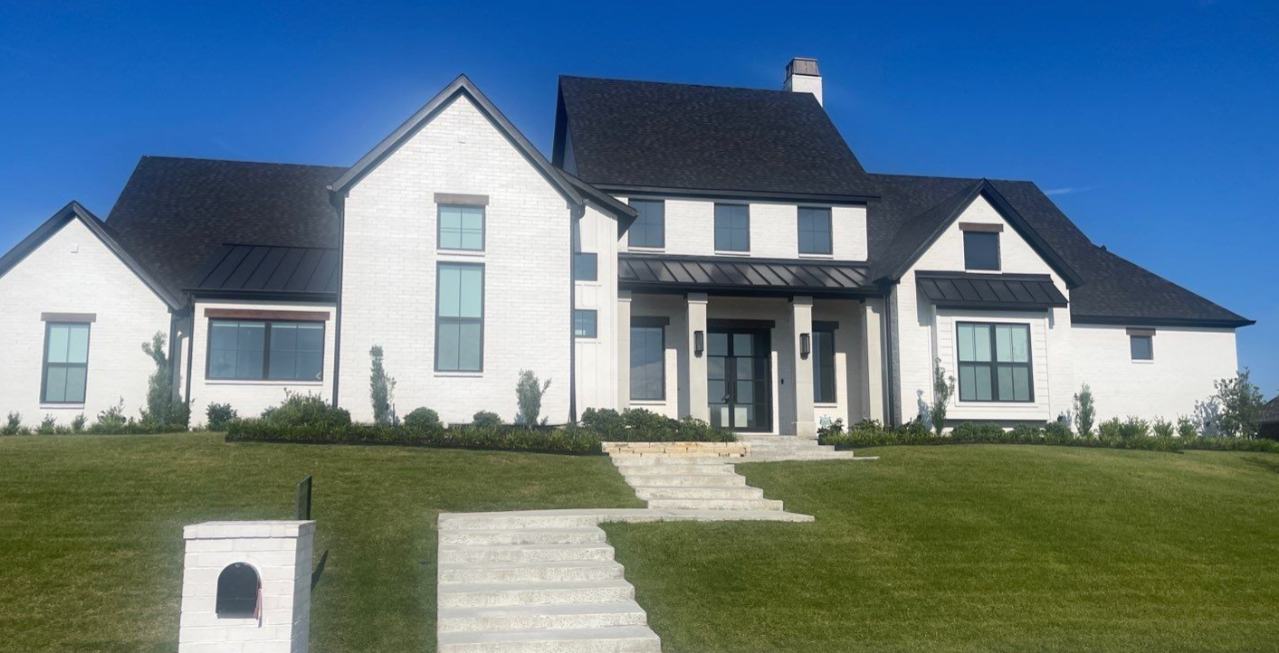 Curbside view of a white house in Carrollton TX